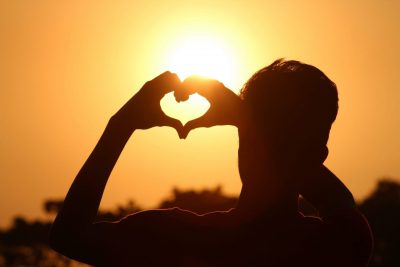 silhouette-photo-of-man-doing-heart-sign-during-golden-hour-712520